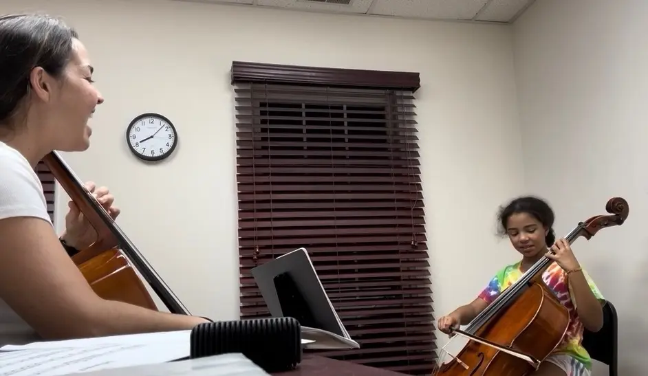 Nicole teaching a student in a private cello lesson